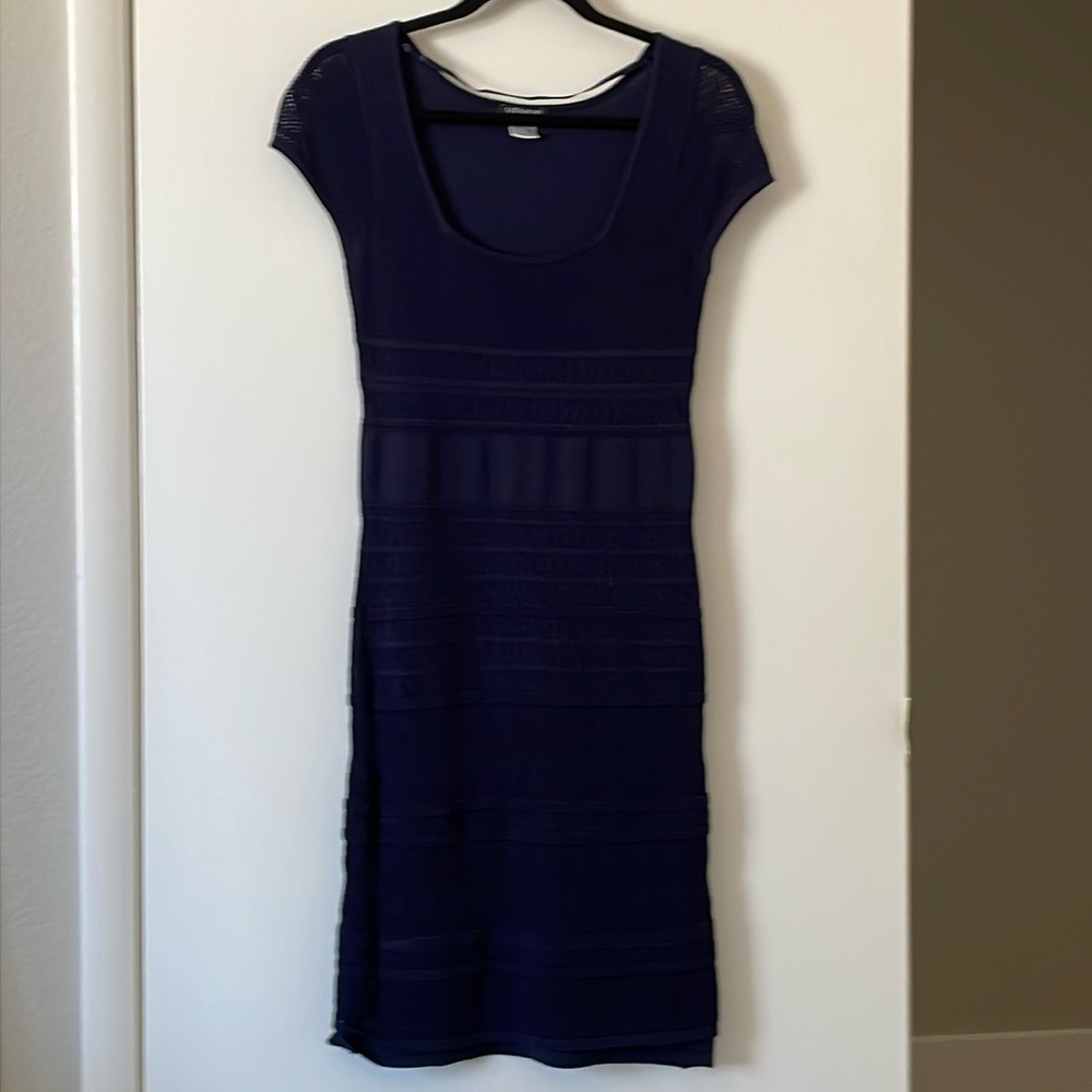Navy blue fitted knit dress .